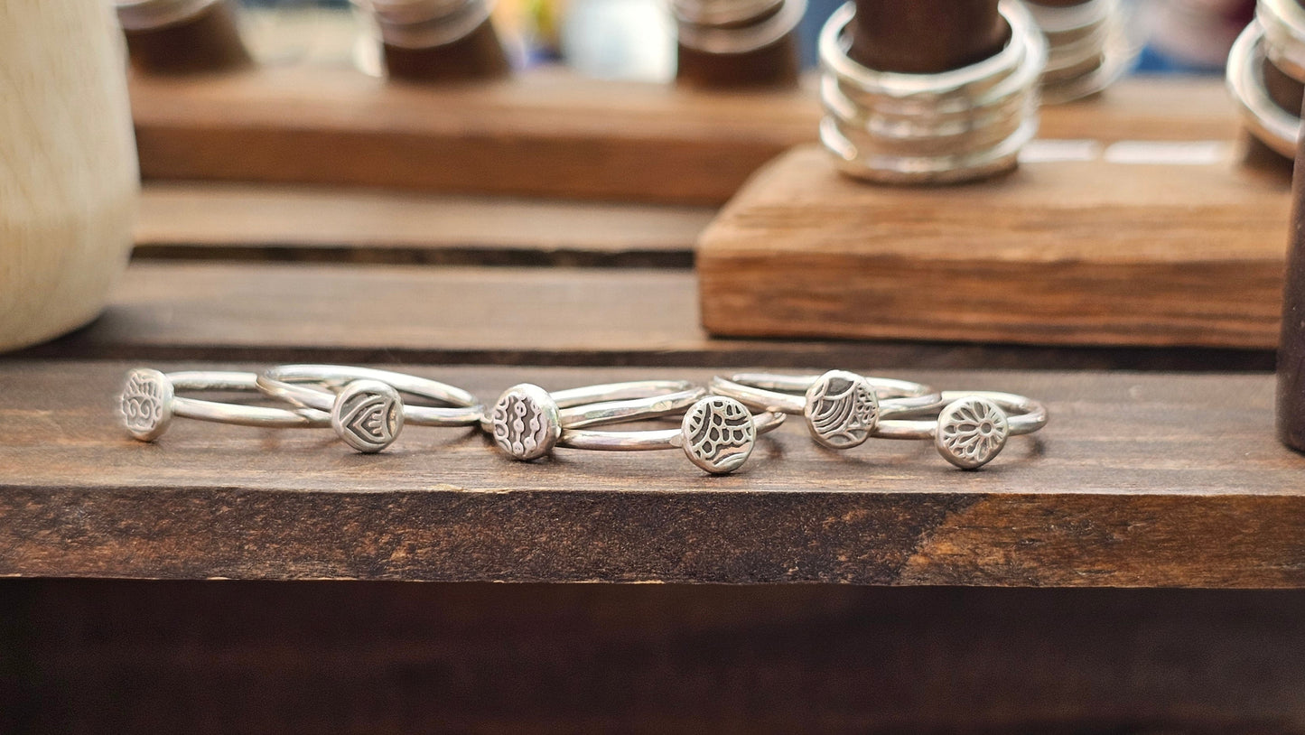 sterling silver rings with textured round topper made by bright side jewelry co in chico california